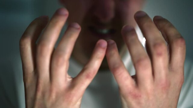 The man made a scandal and communicates loudly and shouts.
Active gestures of aggression during a quarrel.
Angry and aggressive man