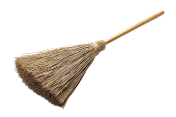 A traditional broom resting on a clean surface, showcasing its natural materials and craftsmanship
