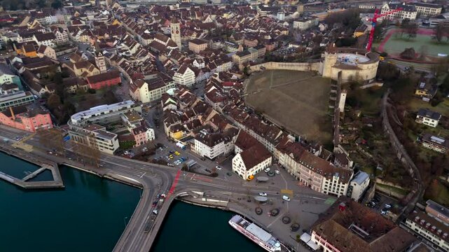 Aerial view of Schaffhausen, Switzerland, with Rhine River winding through historic city at sunrise, rooftops and golden light create breathtaking panorama. Luftaufnahme des Rheins in der Schweiz. 
