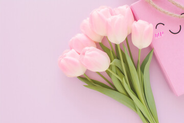 Fototapeta premium an overhead view of a square lavender canvas framed by lush purple tulips,