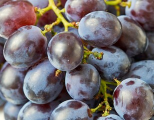 Fototapeta premium Vibrant Purple Grape Cluster Floating Freely with Plump Rounds and Glossy Skin