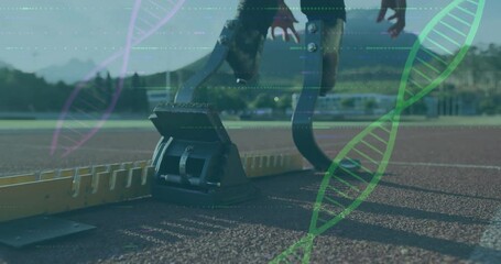 Athlete with prosthetic legs at starting block, DNA strand overlay animation - Powered by Adobe