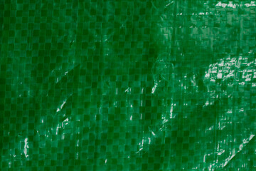 plastic green wrinkled texture background. recycled plastic green