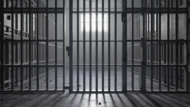 A close-up view of a typical prison cell with bars, walls, and a bed