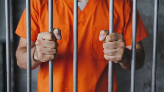 A person imprisoned, potentially awaiting trial or serving a sentence