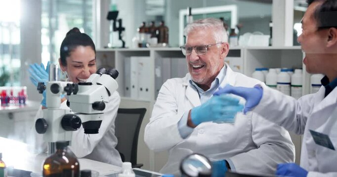 Scientist, people and high five at lab by microscope, celebration and happy pharmaceutical innovation. Man, group and cheers for clinical trial, goals and medical research for vaccine with results