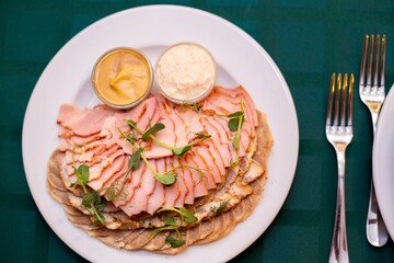 cold cuts meats on a server table