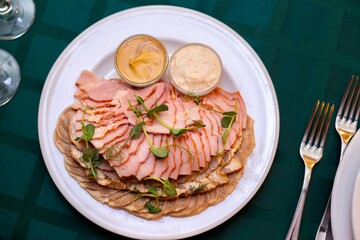 cold cuts meats on a server table