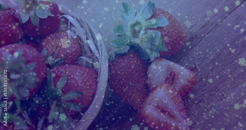 Poster basket of strawberries with snowflake animation overlaying scene in winter setting