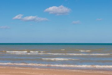 Looking out over the blue calm waters of Lake Michigan in late March at Harrington Beach State Park, Belgium, Wisconsin