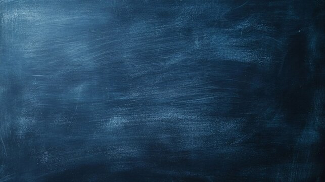 Empty blue chalkboard surface showing signs of erasing