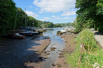 The Helford River in Cornwall England is a tidal river and boats fall dry at low tide