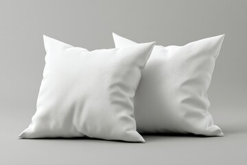 Two soft white pillow mockups are displayed against a simple grey background, perfect for interior design and textile showcasing