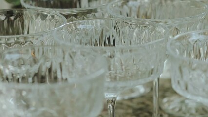 Elegant crystal empty cocktail glasses are perfect for unforgettable celebrations. Welcome drinks, wedding, event. 