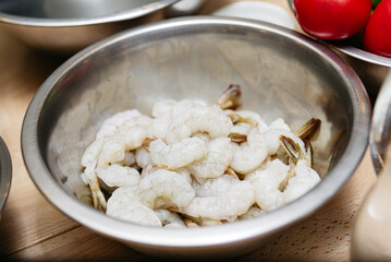 Raw Peeled Shrimp in Metal Bowl.