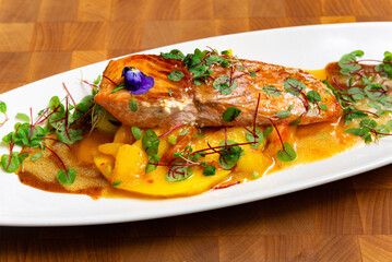 Gourmet salmon fillet with mango sauce.