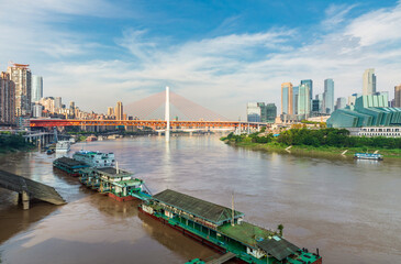 Obraz premium The Yangtze River in Chongqing, China, with buildings, bridges, ships and cityscape.