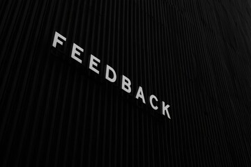 The text feedback on black letter board.