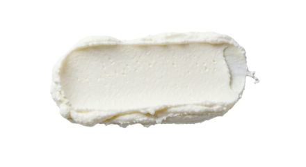 Close up view of a rectangular smear of white cream cheese against a solid black background space filling