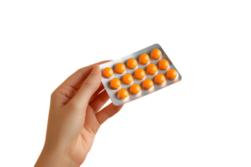 Woman's hand holding medicine blister pack, isolated from transparent background.