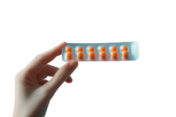 Woman's hand holding medicine blister pack, isolated from transparent background.