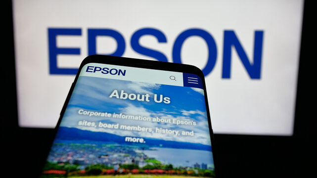 Stuttgart, Germany - 03-18-2025: Mobile phone with logo of electronics company Seiko Epson Corporation on screen in front of website. Focus on top-left of phone display.
