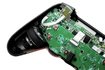 An opened black gaming controller with a green circuit board, buttons, and wires on a transparent background. Perfect for tech and repair visuals.

