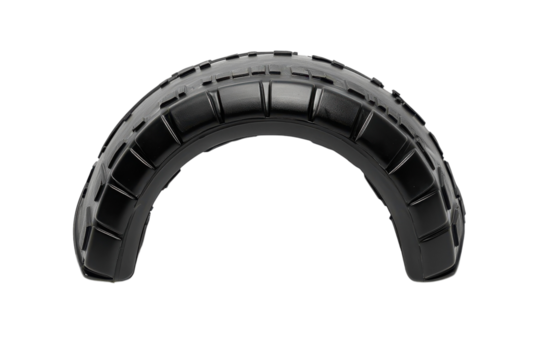 Unique black tire arch resting on a flat surface, showcasing its sleek design and sturdy grip - Powered by Adobe