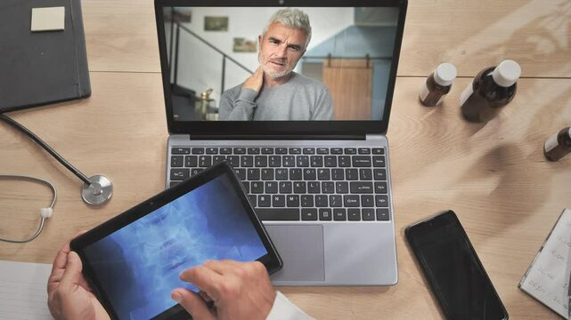telemedicine person with neck pain video call doctor at computer,remote medical support,patient having online consultation,distance heath care support