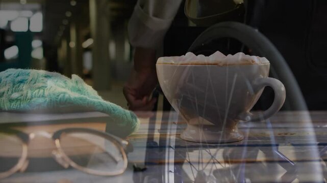 On wooden table, hot chocolate with glasses and knitted hat creating cozy animation