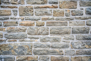 A brick wall with a grey color