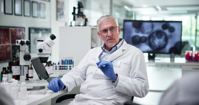 Biotechnology, scientist and people with discussion in lab for medical experiment, gene therapy and innovation. Clinical trial, mature man and talking to team for science research or drug development