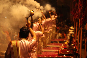 World famous Varansi Ganga Aarti is being performed by the priest of India Varansi. They are unrecognizable with bokeh effect and their spiritual vibe.