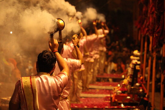 World famous Varansi Ganga Aarti is being performed by the priest of India Varansi. They are unrecognizable with bokeh effect and their spiritual vibe.