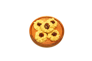 Kue semprit or Butter Cookies is a Traditional Indonesian Cookies, pineapple jam on top for Ied Al Fitr served on Wooden plate and isolated on white background 