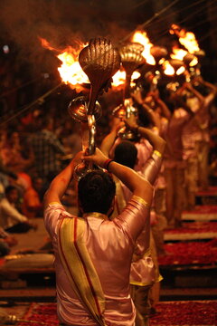 World famous Varansi Ganga Aarti is being performed by the priest of India Varansi. They are unrecognizable with bokeh effect and their spiritual vibe.