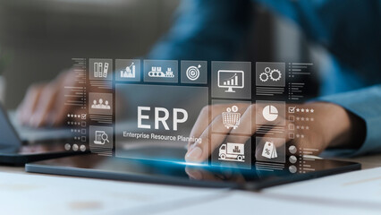 Enterprise resource planning concept. Businessman using tablet and laptop for business management...