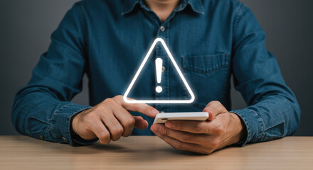  Mobile Security Alert! Man Using Phone with Warning Sign: Data Breach, Fraud, Online Safety, and Risk Awareness.
