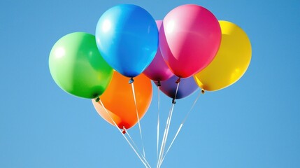 Obraz premium Colorful balloons floating against a clear blue sky. (1)