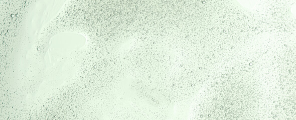 Textured background of cosmetic moisturizing gel or skin serum