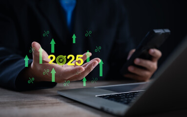 Business goal and success planning for 2025. Businessman holds glowing dartboard target icon with upward arrows, symbolizing future growth, achievement, and strategic vision.	