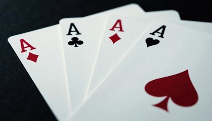 Four aces fanned out, showcasing intricate card details , game, playing cards