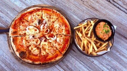 Pizza  and french fries , in lunch time.