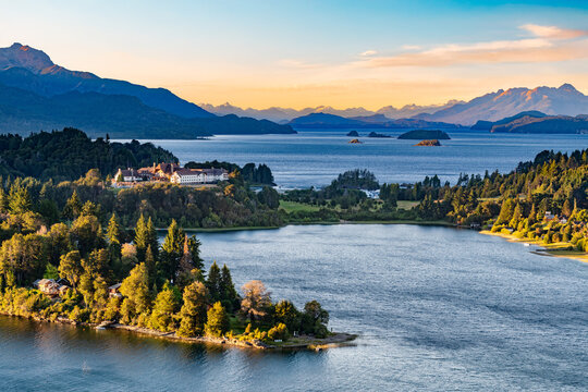 Beautiful scenic view of Llao Llao on Nahuel Huapi lake and Moreno lake at dusk, with the majestic Andes mountain range in the background in San Carlos de Bariloche, Argentina.