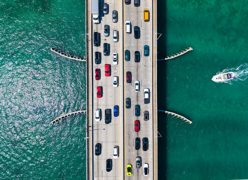 Road connecting town of Bay Harbor Islands to mainland Miami. Top aerial view of the causeway. Key Biscayne bridge. Draw bridge with cars passing. Broad Causeway Bridge spans Biscayne Bay