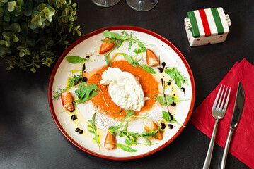 Burrata Cheese with Tomato Sauce and Strawberries.