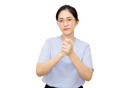 A young woman with glasses is clasping her hands together, expressing a thoughtful or contemplative demeanor.