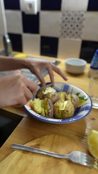 Indulging in a Delightfully Delicious Plate of Potatoes Garnished with Fresh Lemon