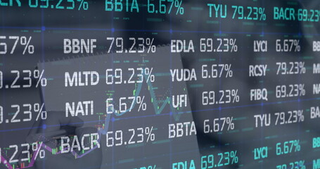 Image of financial data processing over notepad
