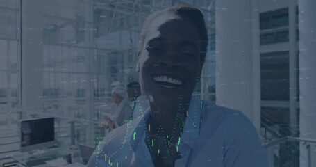 Image of financial data processing over smiling businesswoman in office